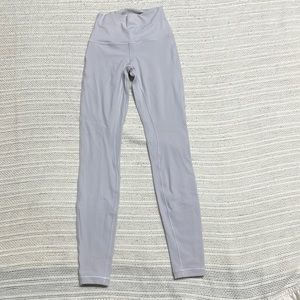 Ladies Lululemon athletic leggings small in a light gray/silver with a pocket